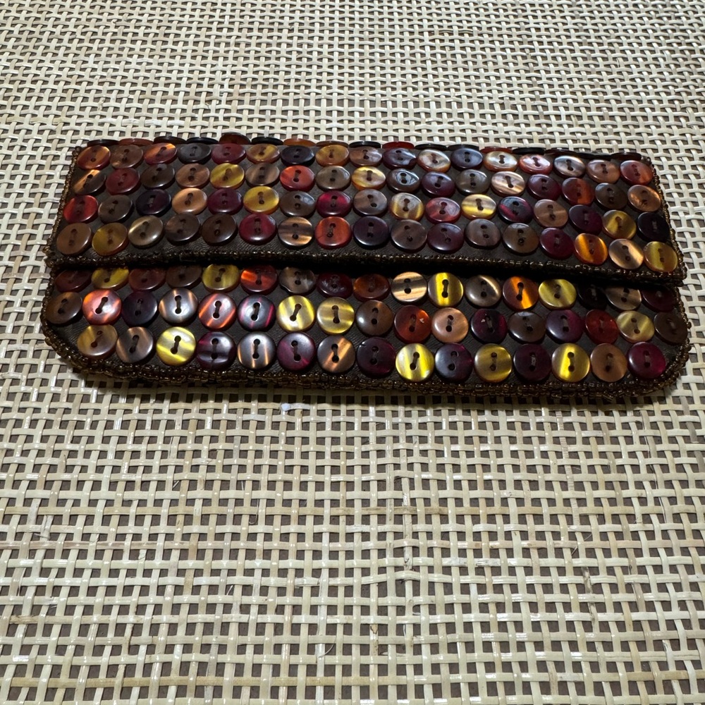 K.C Malhan amber button clutch purse